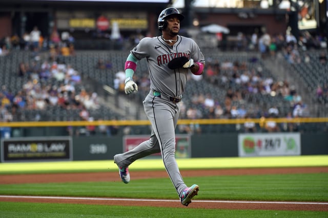 Aug 16, 2025; Denver, Colorado, USA; Arizona Diamondbacks second base Ketel Marte (4) scores during the first inning against the Colorado Rockies at Coors Field. Mandatory Credit: Christopher Hanewinckel-Imagn Images