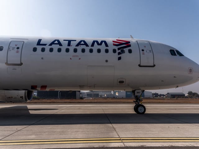 A Latam Airlines aircraft taxis on the tarmac of Arturo Merino Benitez International Airport (SCL) in Santiago, Chile, on Friday, May 5, 2023. Latam Airlines Group will seek to re-list its American depositary receipts on the New York Stock Exchange this year after they were suspended during the bankruptcy. Photographer: Cristobal Olivares/Bloomberg