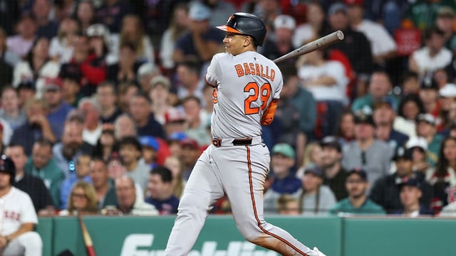 Aug 18, 2025; Boston, Massachusetts, USA; Baltimore Orioles catcher Samuel Basallo (29) hits a two run RBI single during the ninth inning against the Boston Red Sox at Fenway Park. Mandatory Credit: Paul Rutherford-Imagn Images