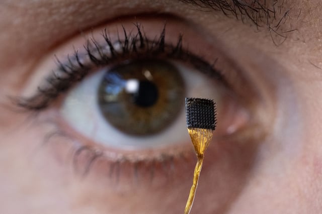 Erin Kunz holds a microelectrode array in the Clark Center, Stanford University, on Thursday, August 8, 2025, in Stanford, Calif. The array is implanted in the brain to collect data. (Photo by Jim Gensheimer)