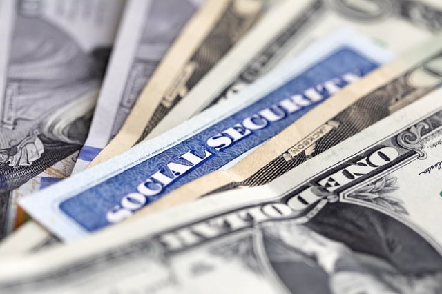 Stock image/file photo: A Social Security card with U.S. Dollars.