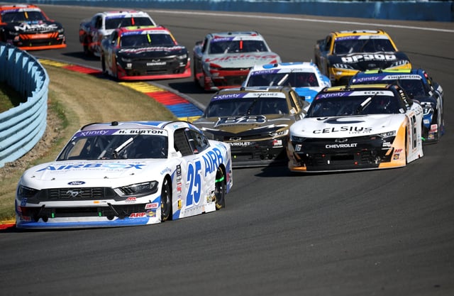 Harrison Burton, driver of the #25 AirBox Ford, Christian Eckes, driver of the #16 Celsius Chevrolet, and Nick Sanchez, driver of the #48 Borchetta Bourbon Chevrolet, race during the NASCAR Xfinity Series Mission 200 at The Glen at Watkins Glen International on August 09, 2025 in Watkins Glen, New York.