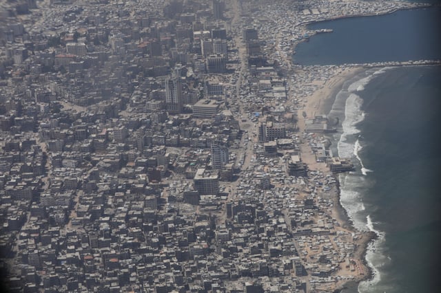 An aerial view from a Jordanian military aircraft shows the Gaza Strip, before humanitarian aid is airdropped over it, in Gaza, August 17, 2025. REUTERS/Alaa Al Sukhni/File Photo