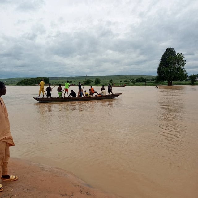People travel by a boat as search and rescue operations continue following a boat accident, in a place given as Sokoto State, Nigeria, in this handout image released on August 17, 2025. National Emergency Management Agency, Nigeria/Handout via REUTERS