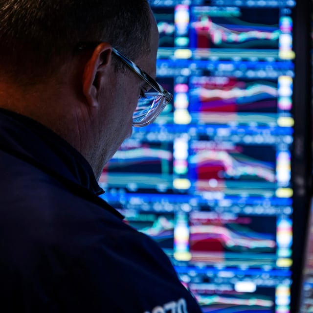 Traders work on the New York Stock Exchange floor on a Friday afternoon, Aug. 15, 2025