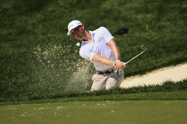 Ben Griffin plays a shot from a bunker on the 11th hole during the second round of the BMW Championship golf tournament Friday, Aug. 15, 2025, in Owings Mills.