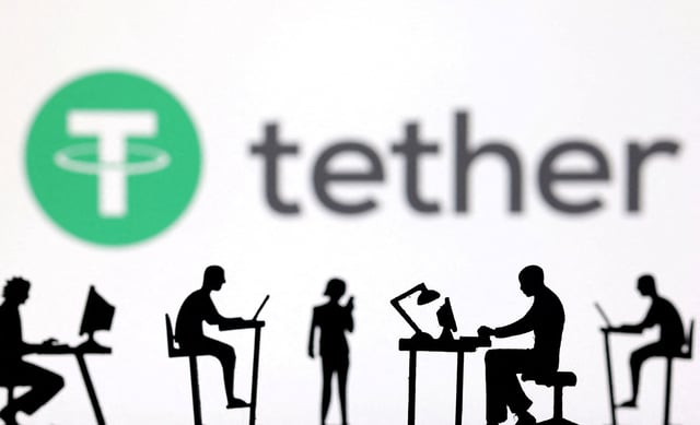 Figurines with computers and smartphones are seen in front of Tether logo in this illustration taken, February 19, 2024. REUTERS/Dado Ruvic/Illustration/File Photo