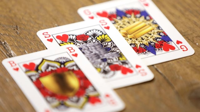 Genderless playing cards designed by Indy Mellink lie on a table in Oegstgeest, Leiden, Netherlands.