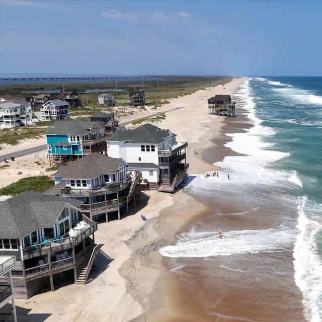 In this aerial image taken from video provided by WVEC-TV, homes along the Atlantic Coast in Dare County, N.C., are seen, Monday, Aug. 18, 2025, ahead of expected impacts from Hurricane Erin. (WVEC-TV via AP)