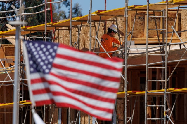 A construction worker is shown at work on a multi-unit residential housing project in Encinitas, California, U.S., July 28, 2025.   REUTERS/Mike Blake/File Photo