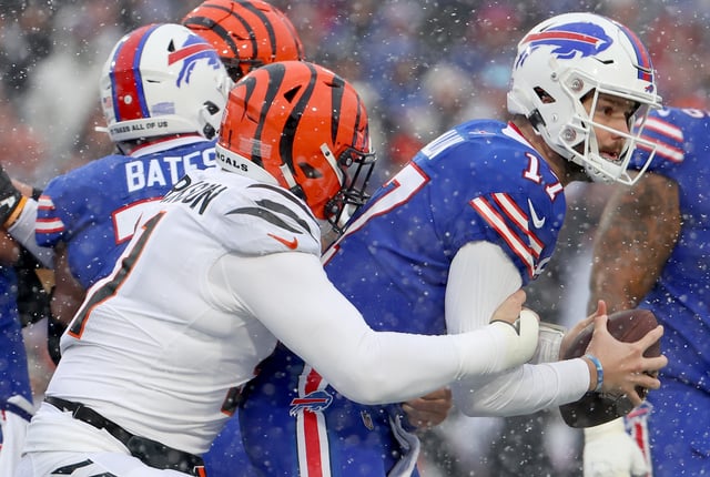 ORCHARD PARK, NEW YORK - JANUARY 22: Trey Hendrickson #91 of the Cincinnati Bengals tackles Josh Allen #17 of the Buffalo Bills during the first quarter in the AFC Divisional Playoff game at Highmark Stadium on January 22, 2023 in Orchard Park, New York. (Photo by Timothy T Ludwig/Getty Images)