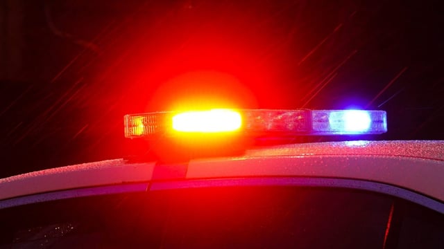 A police vehicle flashes its lights in Philadelphia, Monday, Jan. 17, 2022. (AP Photo/Matt Rourke)