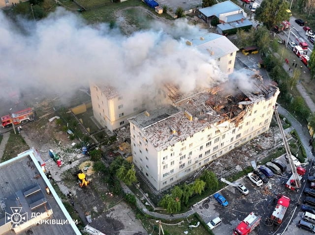 Smoke rises from damaged buildings, at the site of the Russian drone strike, amid Russia's attack on Ukraine, in Kharkiv, Ukraine in this handout picture released August 18, 2025. Press service of the State Emergency Service of Ukraine in Kharkiv region/Handout via REUTERS /File Photo