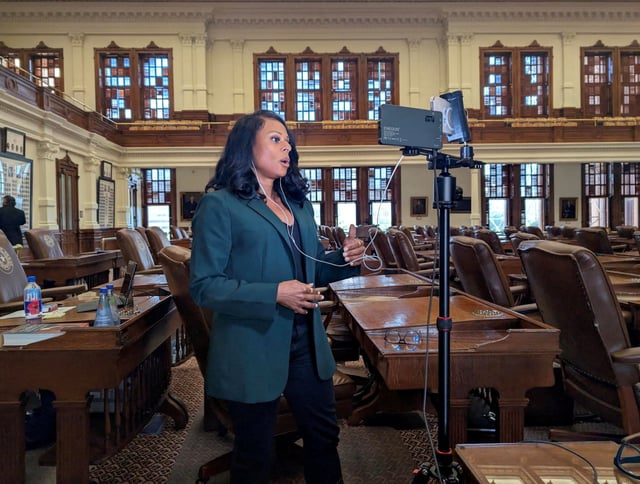 State Rep. Nicole Collier talks on the phone from the floor of the House, where she has chosen to remain until Wednesday, after Democratic lawmakers who had left the state to prevent Republicans from redrawing Texas’s 38 congressional districts returned to the Capitol in Austin, Texas, U.S., August 18, 2025. Collier is staying in the chamber because she did not want to sign the required permission slip allowing lawmakers to leave the Capitol under escort by Department of Public Safety agents. Texas House of Representatives Minority Leader Gene Wu/Handout via REUTERS. THIS IMAGE HAS BEEN SUPPLIED BY A THIRD PARTY. REFILE - CORRECTING INFORMATION FROM "U.S. REP." TO "STATE REP.\