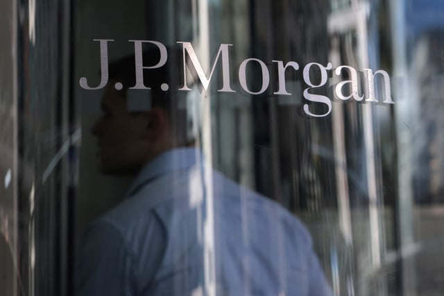 A person enters the JPMorgan Chase & Co. New York Head Quarters in Manhattan, New York City, U.S., June 30, 2022. REUTERS/Andrew Kelly/File Photo