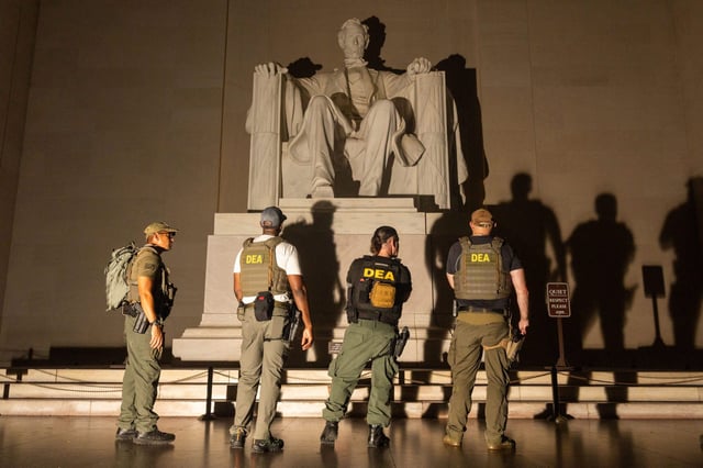 Members of the Drug Enforcement Agency and Police patrol the Lincoln Memorial on August 15, 2025 in Washington, DC.