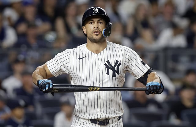 NEW YORK, NEW YORK - AUGUST 13: Giancarlo Stanton #27 of the New York Yankees reacts after striking out during the sixth inning against the Minnesota Twins at Yankee Stadium on August 13, 2025 in New York City.