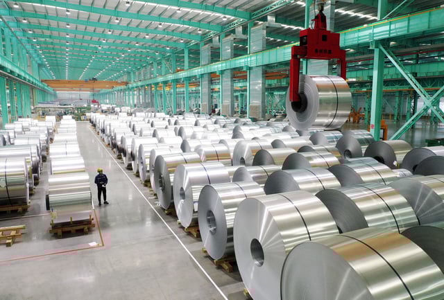 A drone view shows an employee working on the production line of aluminium products at a factory in Huaibei, Anhui province, China February 11, 2025.  China Daily via REUTERS/File Photo