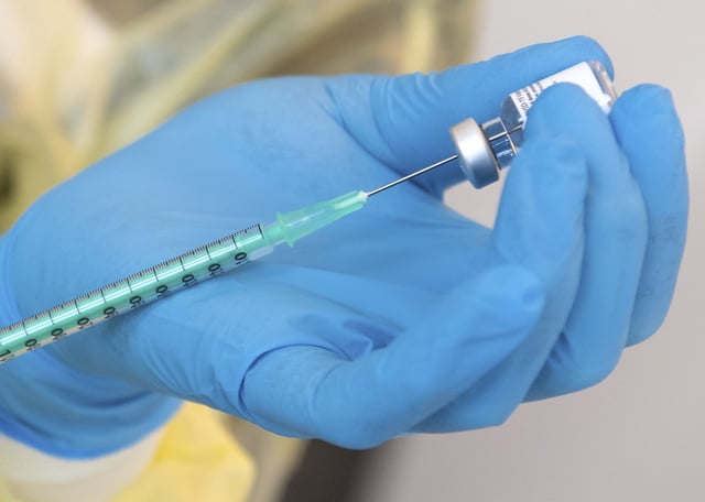 File photo of an employee of the Bavarian Red Cross (BRK) preparing the Biontech/Pfizer vaccine against the corona virus SARS-CoV-2 for vaccination in a vaccination centre, taken in Bavaria, Germany, in January 2021.