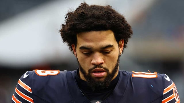 Dec 22, 2024; Chicago, Illinois, USA; Chicago Bears quarterback Caleb Williams (18) walks off the field after the game against the Detroit Lions during the second half at Soldier Field. Mandatory Credit: Mike Dinovo-Imagn Images