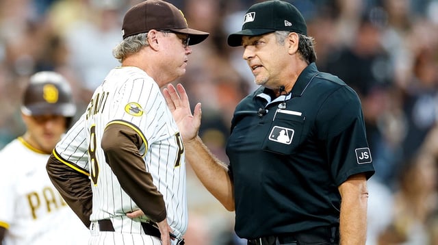 Aug 18, 2025; San Diego, California, USA; San Diego Padres manager Mike Shildt (8) speaks with home plate umpire James Hoye after being ejected from the game during the second inning against the San Francisco Giants at Petco Park. Mandatory Credit: David Frerker-Imagn Images