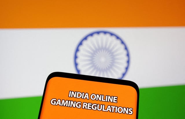 The words "India online gaming regulations" are displayed in front of an Indian flag in this Illustration taken September 14, 2022. REUTERS/Dado Ruvic/Illustration/File Photo