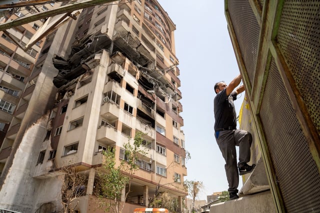 A damaged building in the Saadat Abad neighborhood of Tehran, Iran, is seen on June 26, during a ceasefire between Iran and Israel. The building was reportedly struck by a missile during Israel's initial June 13 attack.