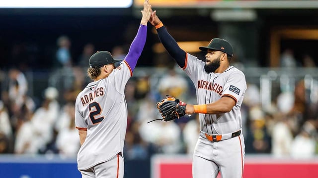 Aug 18, 2025; San Diego, California, USA; San Francisco Giants shortstop Willy Adames (2) celebrates with left fielder Heliot Ramos (17) after defeating the San Diego Padres at Petco Park. Mandatory Credit: David Frerker-Imagn Images
