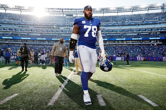 EAST RUTHERFORD, NEW JERSEY - OCTOBER 16: Andrew Thomas #78 of the New York Giants reacts as he walks off the field after defeating the Baltimore Ravens 24-20 at MetLife Stadium on October 16, 2022 in East Rutherford, New Jersey. (Photo by Sarah Stier/Getty Images)