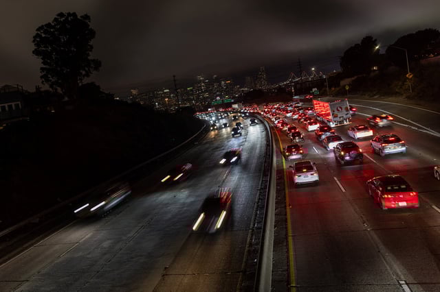 Car traffic is seen during rush hour in downtown San Francisco, California, U.S., July 29, 2025. REUTERS/Carlos Barria/File photo