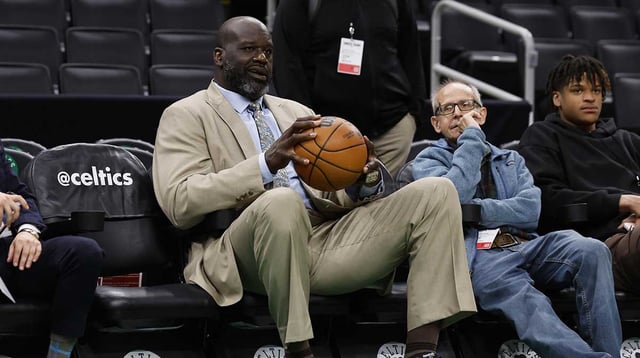 May 25, 2023; Boston, Massachusetts, USA; Shaquille O Neal holds a basketball courtside before game five of the Eastern Conference Finals between the Miami Heat and the Boston Celtics in the 2023 NBA playoffs at TD Garden. Mandatory Credit: Winslow Townson-Imagn Images