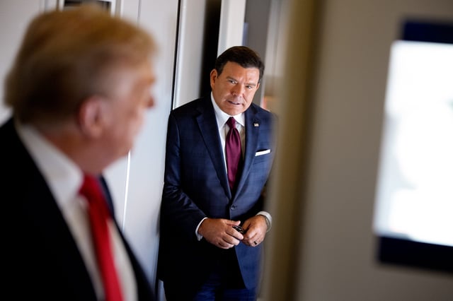 President Donald Trump, accompanied by FOX News journalist Bret Baier, speaks to members of the media aboard Air Force One on Aug. 15, 2025, in flight.