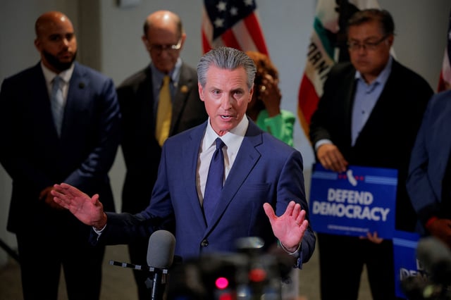 California Governor Gavin Newsom speaks to the press following an announcement of the redrawing of California's congressional maps, calling on voters to approve a ballot measure, in response to a similar move in Texas being supported by U.S. President Donald Trump, in Los Angeles, California, U.S., August 14, 2025.  REUTERS/Mike Blake/File photo