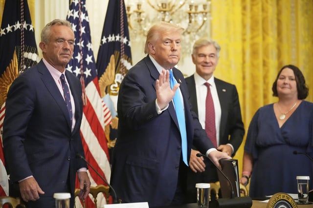 President Donald Trump waves at an event to promote his proposal to improve Americans&#39; access to their medical records in the East Room of the White House, Wednesday, July 30, 2025, in Washington, as from left Health and Human Services Secretary Robert F. Kennedy Jr., Centers for Medicare &amp; Medicaid Services administrator Dr. Mehmet Oz and Amy Gleason, acting administrator of the U.S. Department of Government Efficiency, watch.