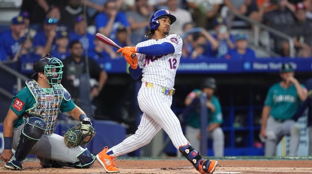 Aug 17, 2025; Williamsport, Pennsylvania, USA; New York Mets infielder Francisco Lindor (12) hits a single against the Seattle Mariners in the first inning at Journey Bank Ballpark at Historic Bowman Field. Mandatory Credit: Kyle Ross-Imagn Images