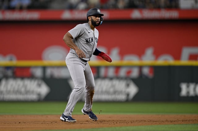 Aug 4, 2025; Arlington, Texas, USA; New York Yankees right fielder Amed Rosario (14) in action during the game between the Texas Rangers and the New York Yankees at Globe Life Field. Mandatory Credit: Jerome Miron-Imagn Images/ File Photo