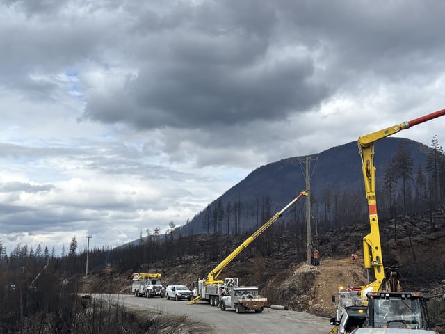 BC Hydro crews working to restore power to a Vancouver Island community after a wildfire destroyed power poles and lines.