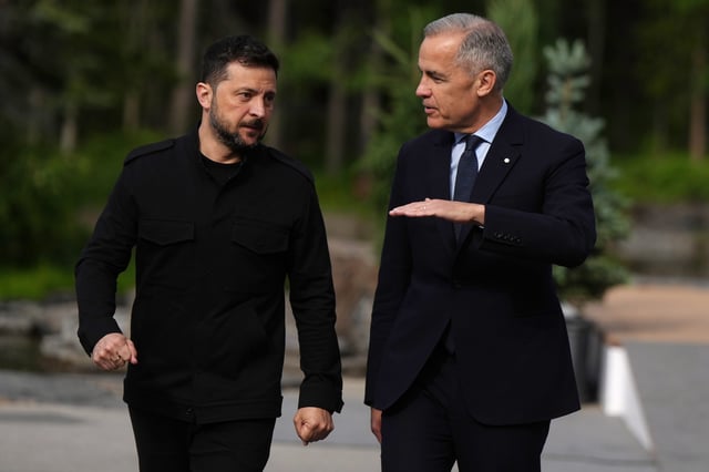 Canadian Prime Minister Mark Carney, right, welcomes Ukrainian President Volodymyr Zelenskyy to the G7 Summit in Kananaskis, Alta., on Tuesday, June 17, 2025. THE CANADIAN PRESS/Darryl Dyck