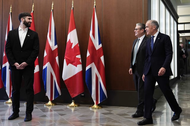 Prime Minister of Canada Mark Carney, right, and Prime Minister of the United Kingdom Keir Starmer meet with Aidan Gomez, left, CEO of AI startup Cohere, on Parliament Hill in Ottawa on Sunday, June 15, 2025. THE CANADIAN PRESS/Justin Tang