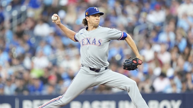 Aug 15, 2025; Toronto, Ontario, CAN; Texas Rangers starting pitcher Jacob deGrom (48) pitches to the Toronto Blue Jays during the first inning at Rogers Centre. Mandatory Credit: John E. Sokolowski-Imagn Images