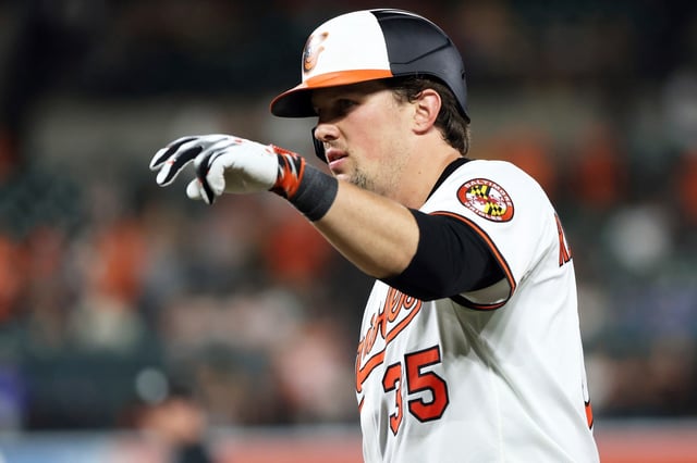 Baltimore Orioles&#39; Adley Rutschman celebrates after hitting a single during the ninth inning of a baseball game against the Seattle Mariners, Tuesday, Aug. 12, 2025, in Baltimore. (AP Photo/Daniel Kucin Jr.)