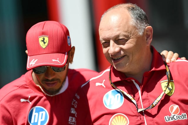 Ferrari's British driver Lewis Hamilton (L) and Ferrari's French team principal Frederic Vasseur speak ahead of the first practice session for the 2025 Emilia Romagna Formula One Grand Prix at the Imola autodrome in Imola, on May 16, 2025.