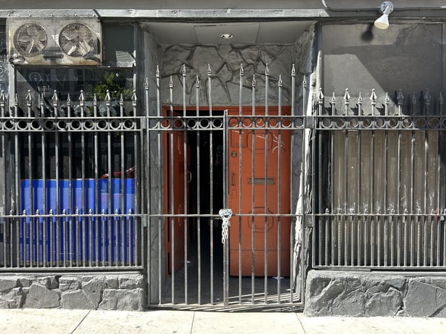 The Edinburgh Castle Pub was sealed by a padlock and chain after being evicted, pictured on Aug. 15, 2025. Photo by Jessica Blough.
