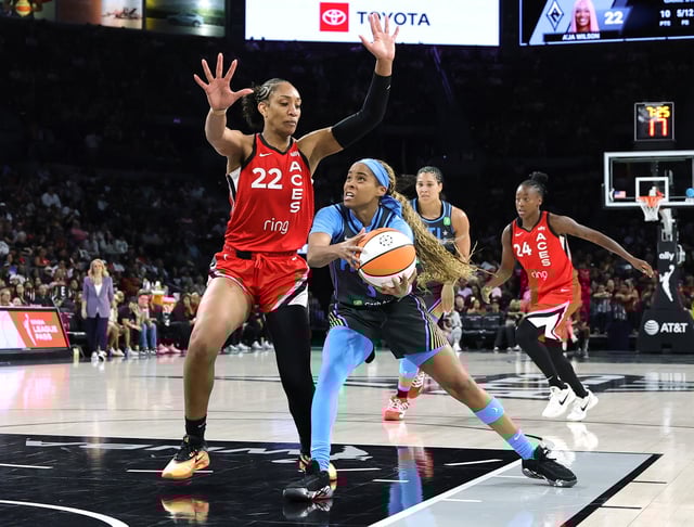 Jordin Canada #3 of the Atlanta Dream drives to the basket against A'ja Wilson #22 of the Las Vegas Aces in the third quarter of their game at Michelob ULTRA Arena on July 22, 2025 in Las Vegas, Nevada. The Aces defeated the Dream 87-72.