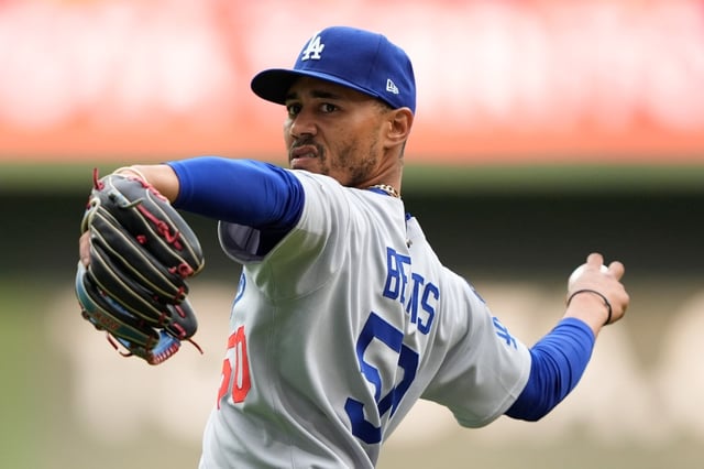 Moving Mookie Betts from shortstop back to right field is a move a lot of Dodgers fans wants to see the team make to improve the outfield defense, but Manager Dave Roberts says it is not something they are planning to do right now. (AP Photo/Aaron Gash)