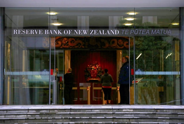 A security guard stands in the main entrance to the Reserve Bank of New Zealand located in central Wellington, New Zealand, July 3, 2017. REUTERS/David Gray/ File Photo