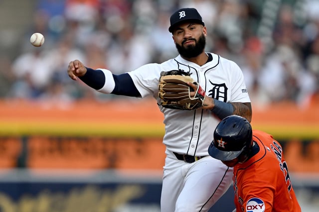 Aug 19, 2025; Detroit, Michigan, USA;  Detroit Tigers second baseman Gleyber Torres (25) tries to turn a double play over Houston Astros shortstop Jeremy Pena (3) in the first inning at Comerica Park. Mandatory Credit: Lon Horwedel-Imagn Images