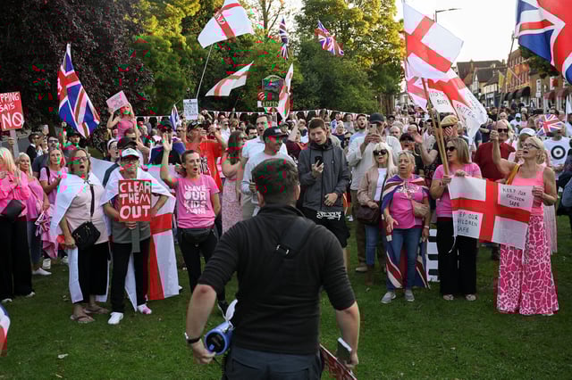 Protesters attend an anti-immigration demonstration, in Epping, Britain, August 8, 2025. REUTERS/Jaimi Joy/File Photo