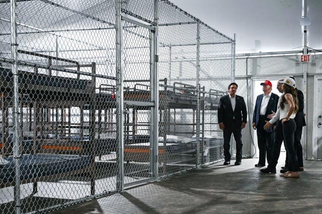 President President Donald Trump, Florida Governor Ron DeSantis, and Secretary of Homeland Security Kristi Noem tour a migrant detention center, dubbed "Alligator Alcatraz," located at the site of the Dade-Collier Training and Transition Airport in Ochopee, Florida on July 1, 2025.
