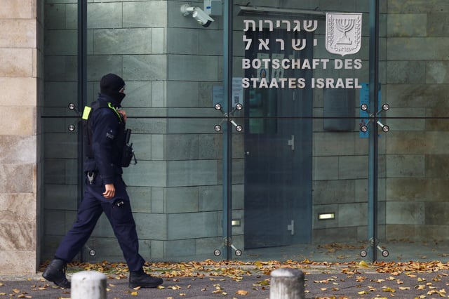 A member of police walks next to the embassy of Israel in Berlin, Germany, October 20, 2024. REUTERS/Lisi Niesner/File Photo